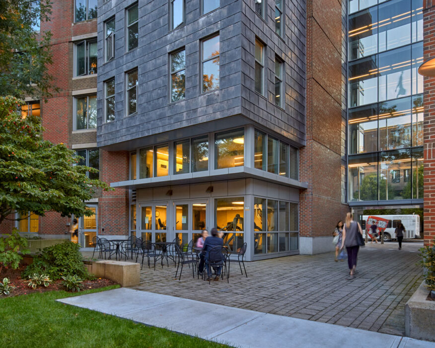 People walk in front of University Housing at Harvard in Cambridge.