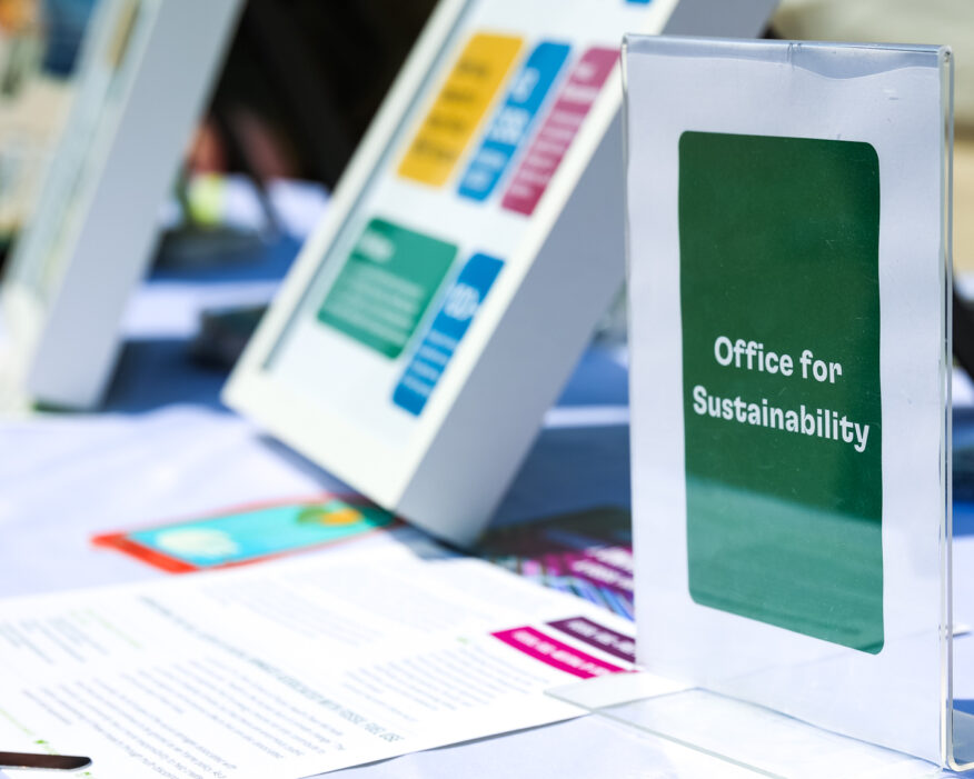 Close-up of tabling materials and signage during a Harvard Earth Day event in 2023.