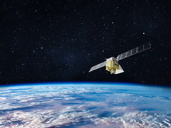 Photo of a satellite in space over earth.
