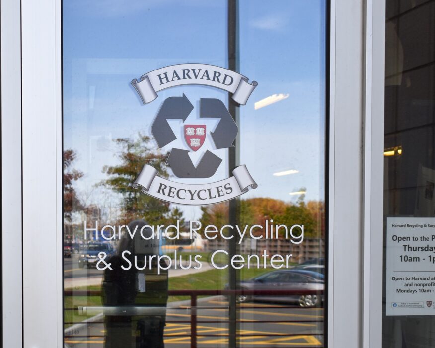 Harvard Recycling and Surplus Center Sign on a glass door.